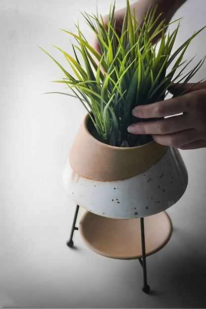 HongLuo Artisan Planters Family featuring a modern two-tone ceramic planter with green grass plant, combining beige and white speckled design on elevated metal stand, perfect for contemporary home decor and indoor gardening